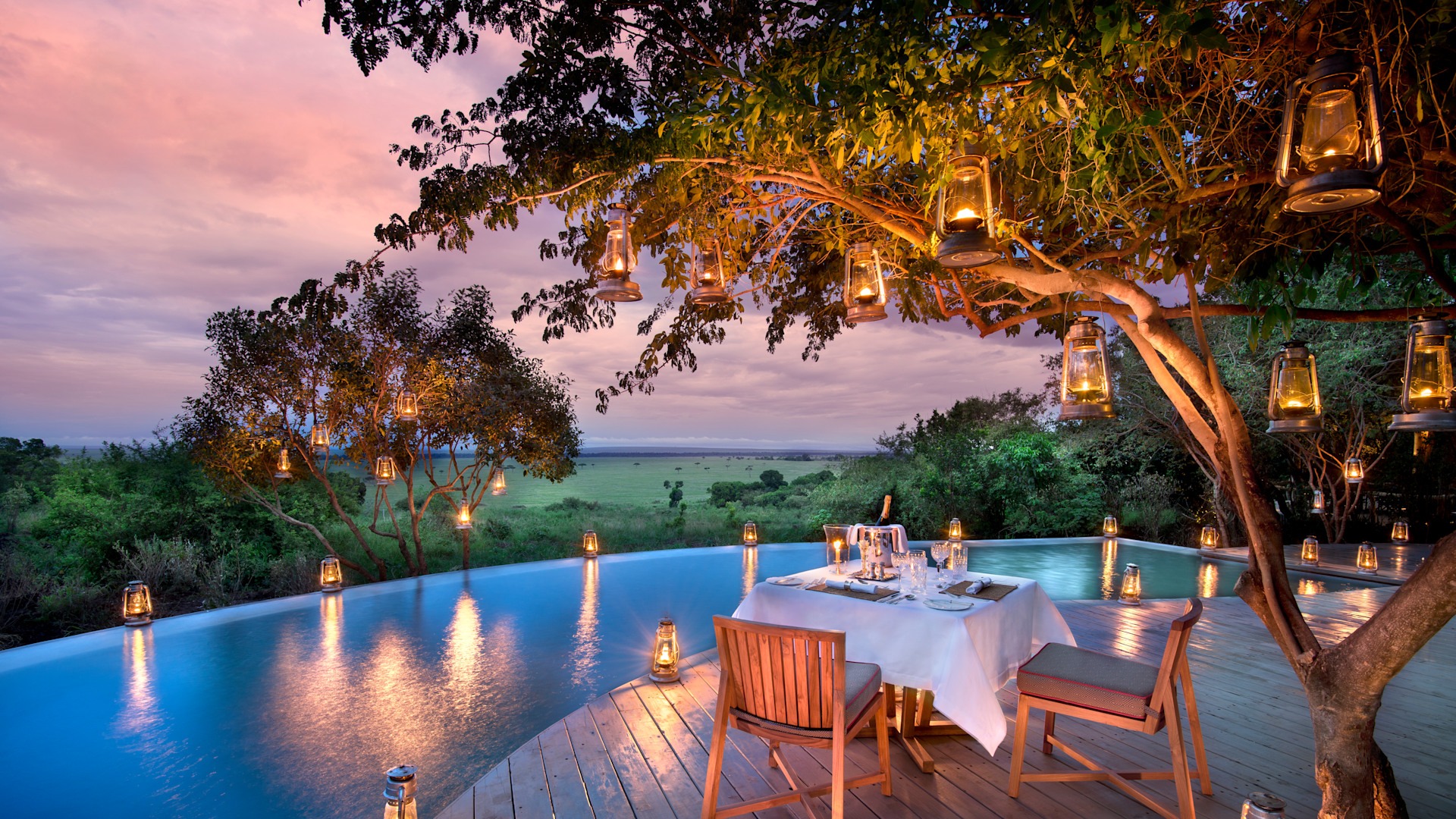 A luxury tented camp overlooking the Masai Mara at golden hour