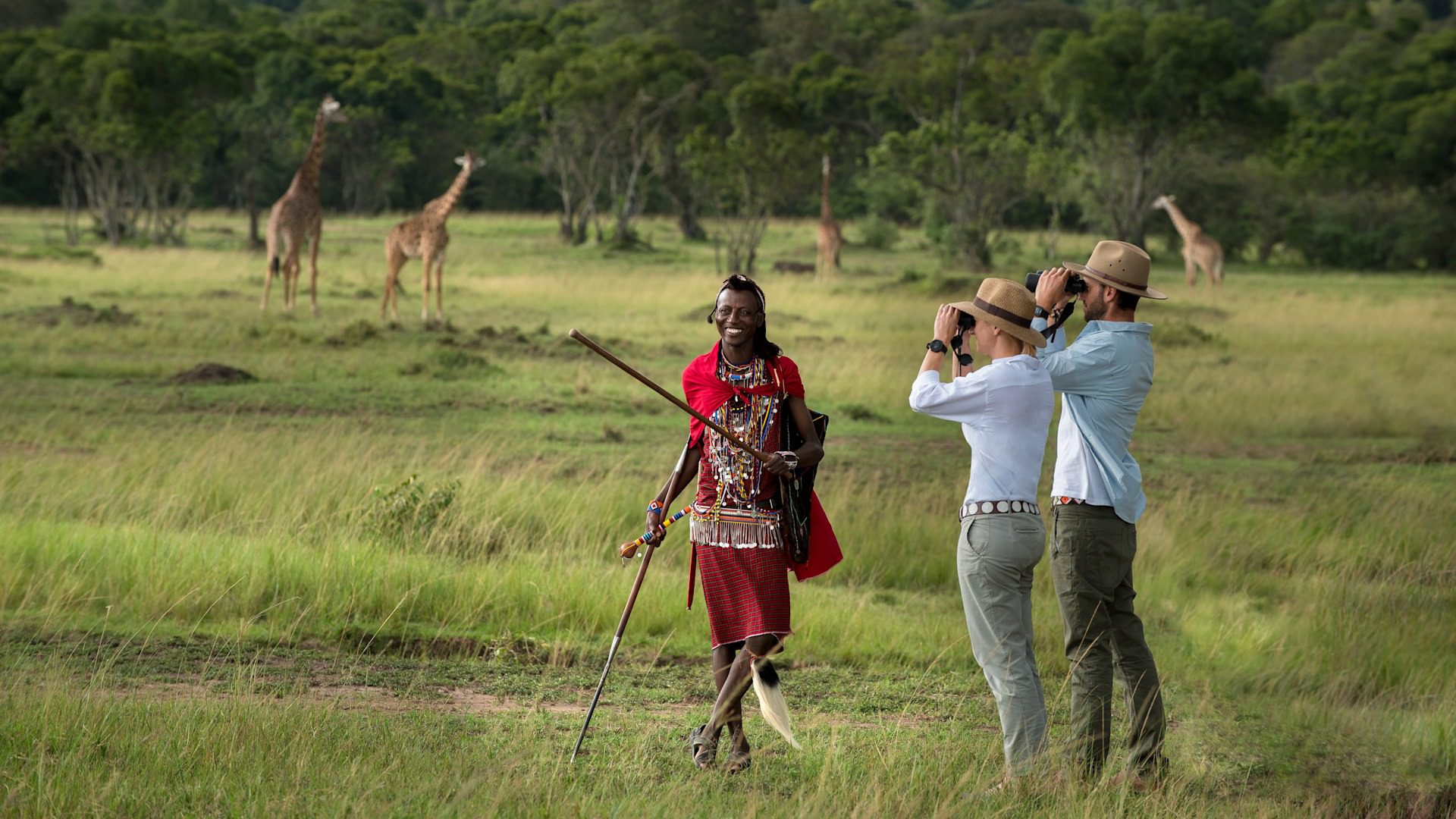 Kenya-Kichwa-Experiences-Walking-safari-two-guests-with-binoculars-and-Maasai